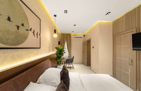 Modern bedroom suite — Lagos hospitality build delivered 2025